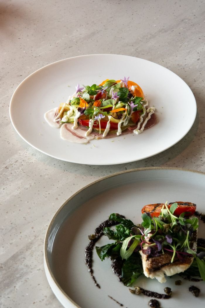 Artfully plated dishes highlighting fine dining in a Tokyo cafe, showcasing fresh ingredients and artistic presentation.
